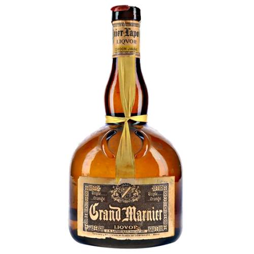 This is a collectible bottle of Creme de Grand Marnier a cream liqueur from the makers of Grand Marnier.