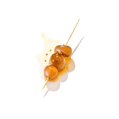 Caramel onion are small cocktail onions cooked in caramel sugars until golden brown.