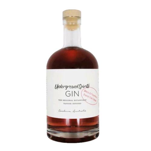Pepperberry Liqueur flavoured gin with strong bite and red in color.